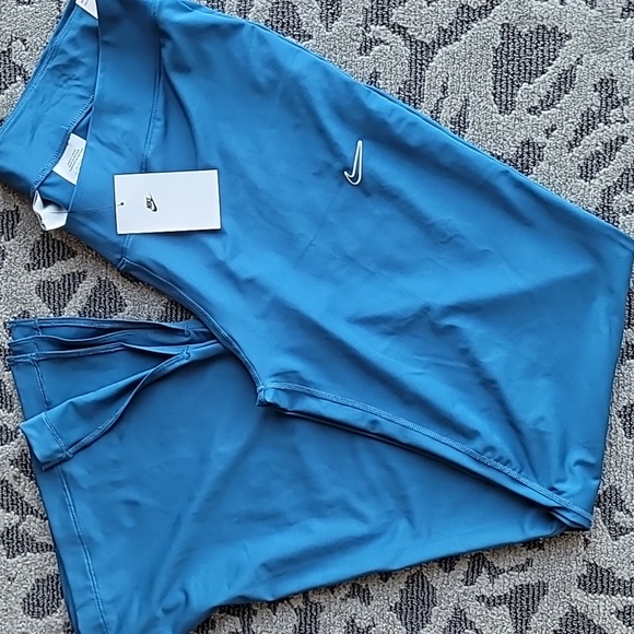 NEW w/tag NIKE TIGHT FIT MID RISE LEGGINGS with FLARE BOTTOM - Picture 1 of 7